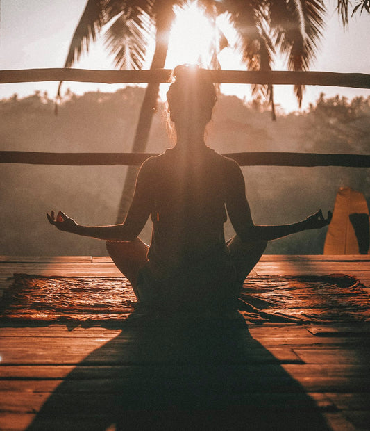 Woman in yoga pose surrounded by calm nature — ZENVY Yoga & Serenity