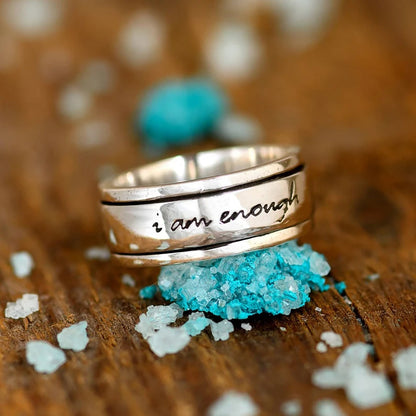 Nuevo anillo antiestrés giratorio con letras rotatorias