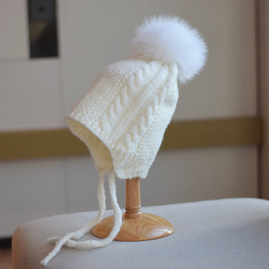 Joli bonnet en laine tressé pour femme