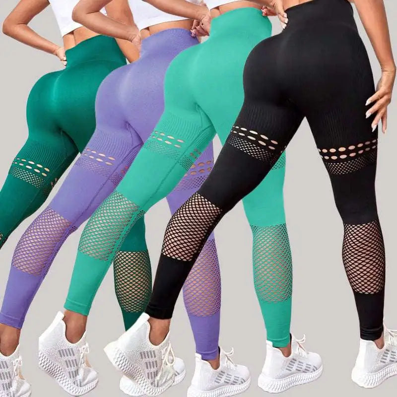 Pantalones de yoga sin costura ahuecados con paneles de malla