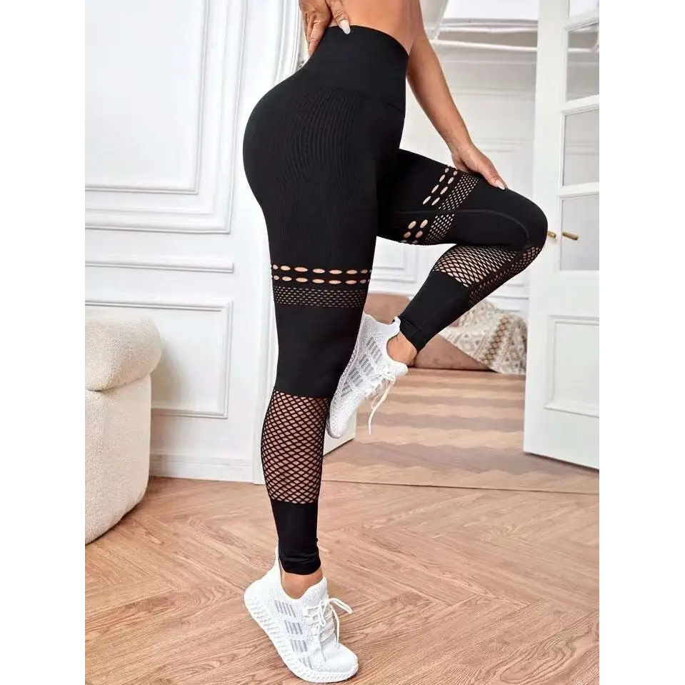 Pantalones de yoga sin costura ahuecados con paneles de malla
