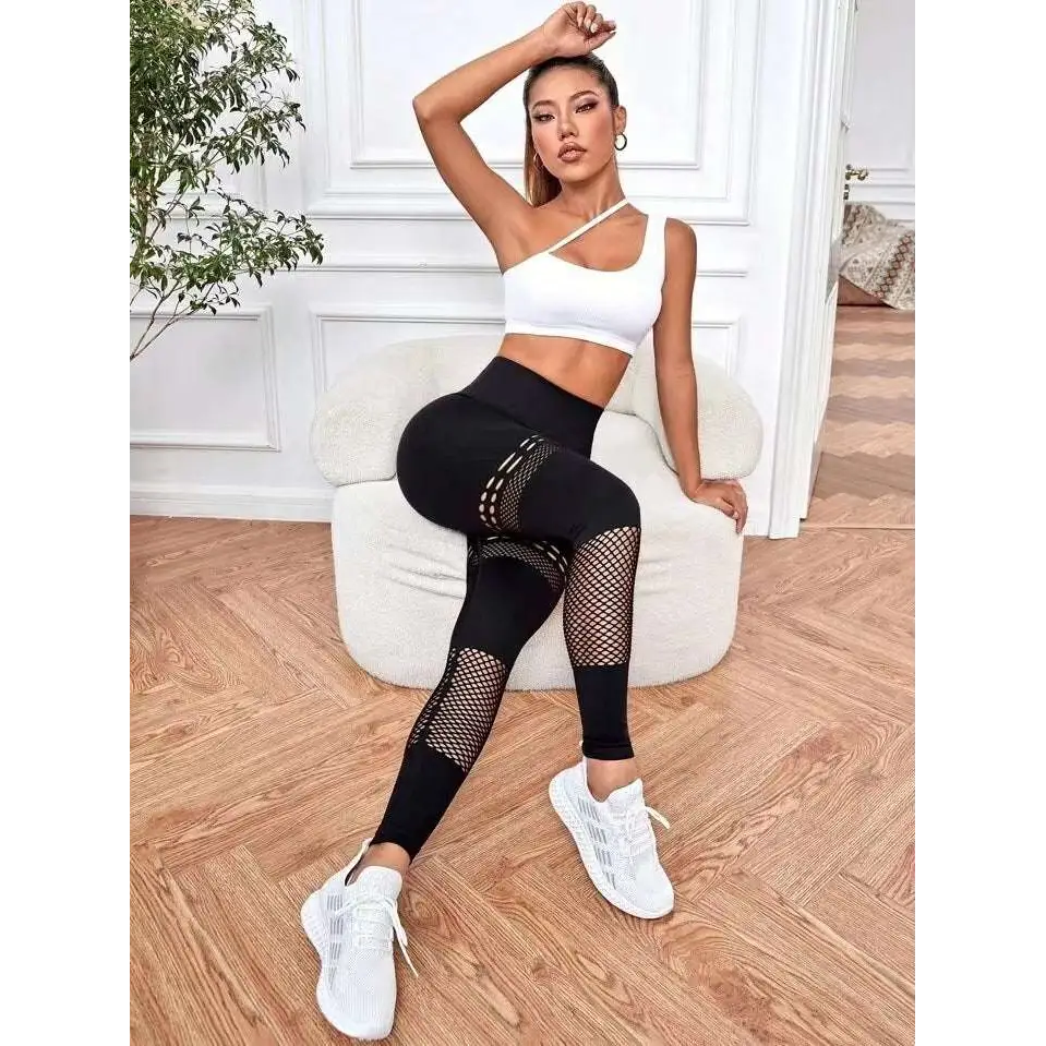 Pantalones de yoga sin costura ahuecados con paneles de malla