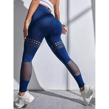 Pantalones de yoga sin costura ahuecados con paneles de malla
